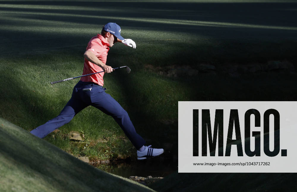 Denmark s Nicolai Hojgaard leaps over over Ray s Creek after taking a drop on the thirteenth hole during the third round of the Masters Tournament at Augusta National Golf Club in Augusta, Georgia on Saturday, April 13, 2024. AUG20240413138 JOHNxANGELILLO