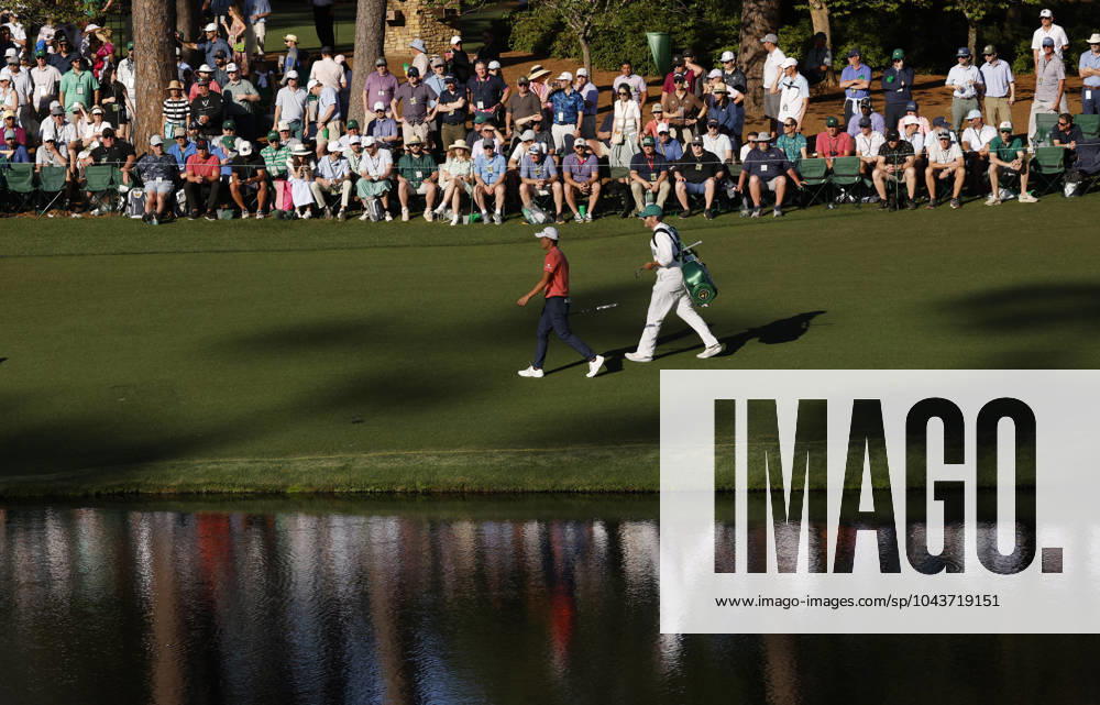 Collin Morikawa and his caddie walk to the sixteenth green during the third round of the Masters Tournament at Augusta National Golf Club in Augusta, Georgia on Saturday, April 13, 2024. AUG20240413149 JOHNxANGELILLO