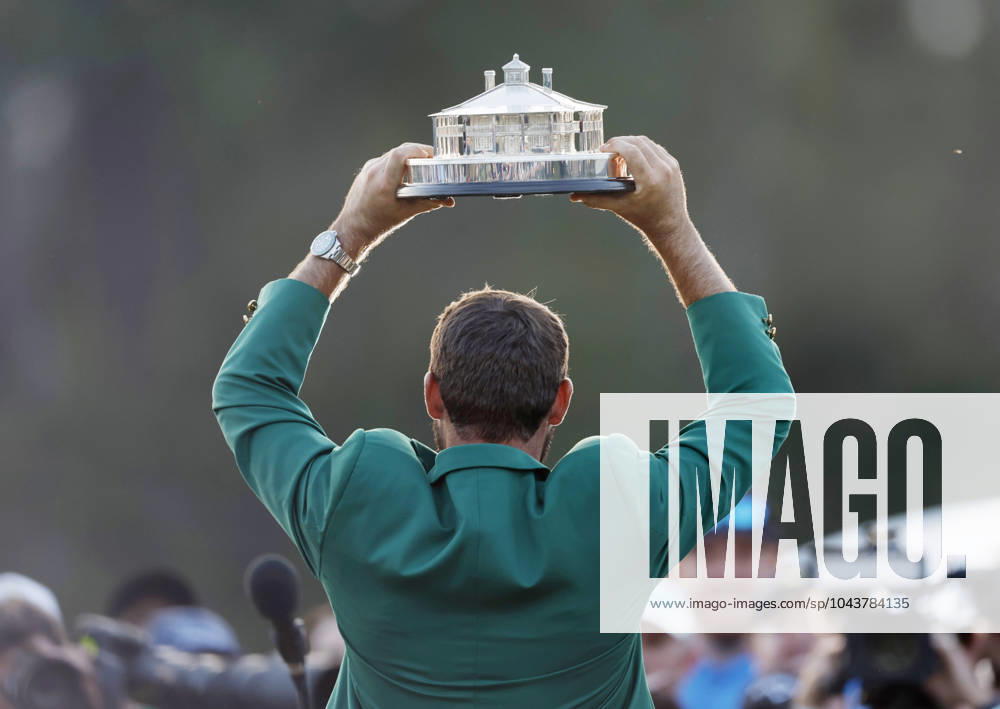 Scottie Scheffler raises his trophy after winning the Masters tournament at Augusta National Golf Club in Augusta, Georgia on Sunday, April 14, 2024. Scheffler won with a score of 11 under par. AUG20240414173 JOHNxANGELILLO