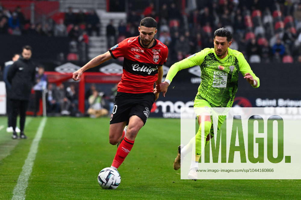 Mehdi MERGHEM ( 10 - Guingamp ) and Florent HANIN ( 26 - Angers ) during the Ligue 2 match between EA Guingamp and Angers SCO at Stade Municipal de Roudourou on April 23, 2024 in Guingamp, France. ( Photo by federico pestellini panoramic ) - FOOTBALL : Guingamp vs Angers - Ligue 2 - 23 04 2024 FedericoPestellini Panoramic
