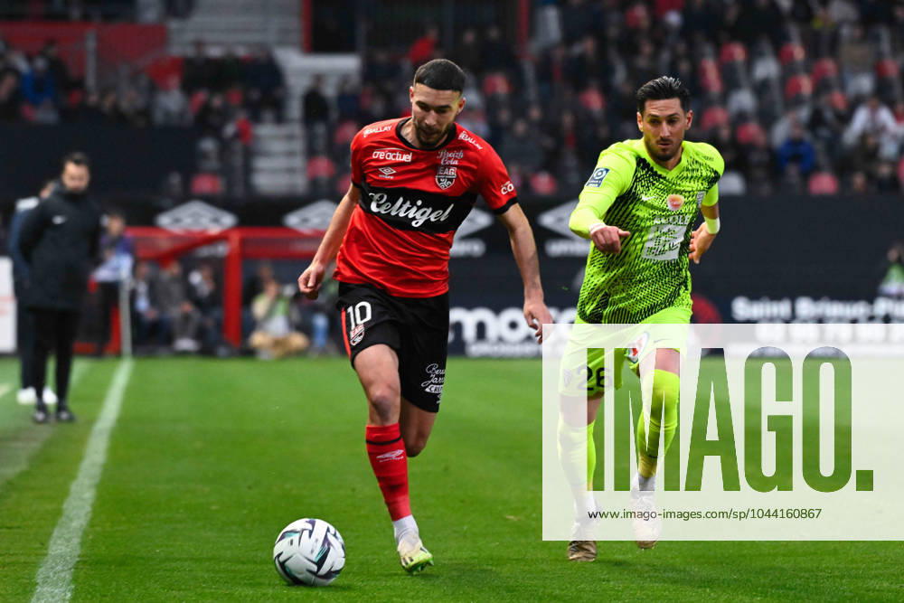 Mehdi MERGHEM ( 10 - Guingamp ) and Florent HANIN ( 26 - Angers ) during the Ligue 2 match between EA Guingamp and Angers SCO at Stade Municipal de Roudourou on April 23, 2024 in Guingamp, France. ( Photo by federico pestellini panoramic ) - FOOTBALL : Guingamp vs Angers - Ligue 2 - 23 04 2024 FedericoPestellini Panoramic