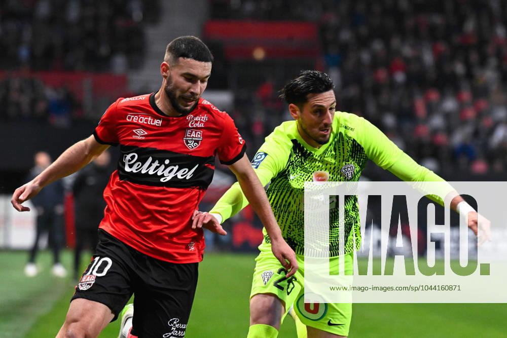 Mehdi MERGHEM ( 10 - Guingamp ) and Florent HANIN ( 26 - Angers ) during the Ligue 2 match between EA Guingamp and Angers SCO at Stade Municipal de Roudourou on April 23, 2024 in Guingamp, France. ( Photo by federico pestellini panoramic ) - FOOTBALL : Guingamp vs Angers - Ligue 2 - 23 04 2024 FedericoPestellini Panoramic