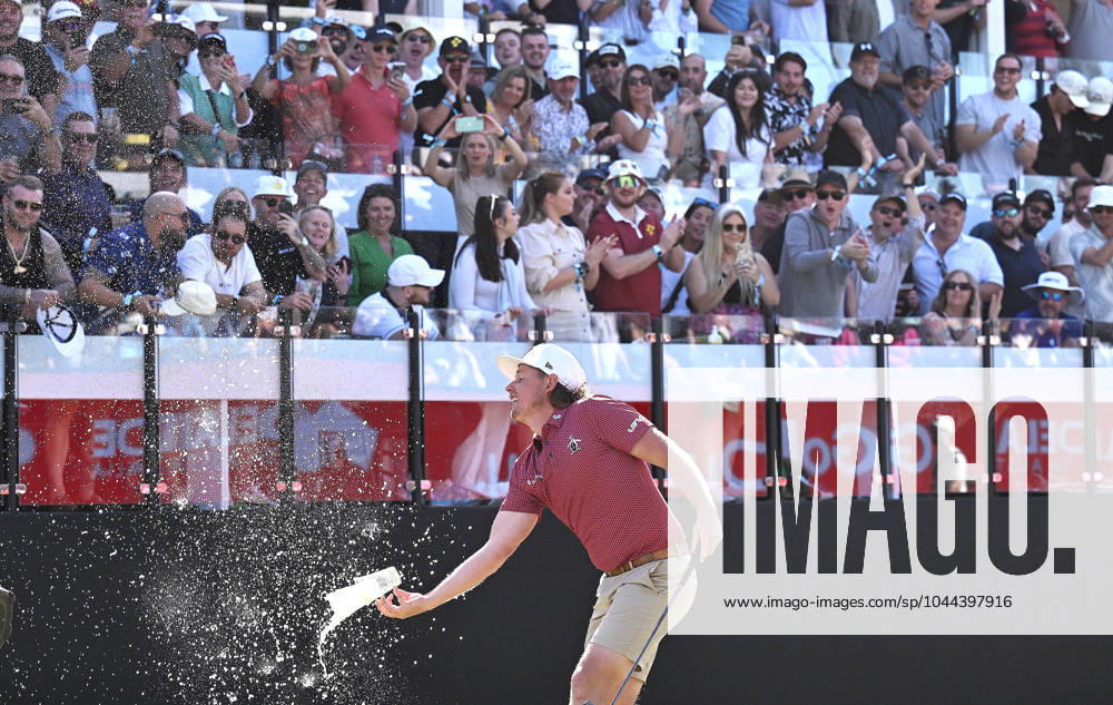 LIV GOLF ADELAIDE, Cameron Smith catches drinks thrown by spectators on the Watering Hole during the final round of LIV Golf Adelaide at the Grange Golf Club in Adelaide, Sunday, April 28, 2024. ( NO ARCHIVING, , NO USE IN BOOKS WITHOUT CONSENT ADELAIDE SOUTH AUSTRALIA AUSTRALIA