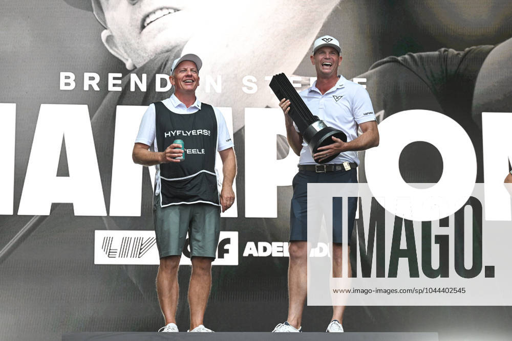 LIV GOLF ADELAIDE, Brendan Steele of HyFlyers GC and his caddy with the winners trophy during LIV Golf Adelaide at the Grange Golf Club in Adelaide, Sunday, April 28, 2024. ( NO ARCHIVING, , NO USE IN BOOKS WITHOUT CONSENT ADELAIDE SOUTH AUSTRALIA AUSTRALIA
