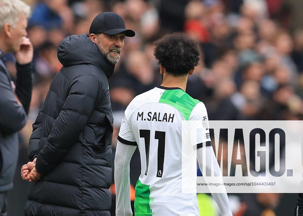 London, England, 27th April 2024. Jurgen Klopp, Manager of Liverpool and Mohamed Salah of Liverpool exchange words on the touchline during the Premier League match at the London Stadium, London. Picture credit should read: Paul Terry Sportimage . SPI-3108-0158