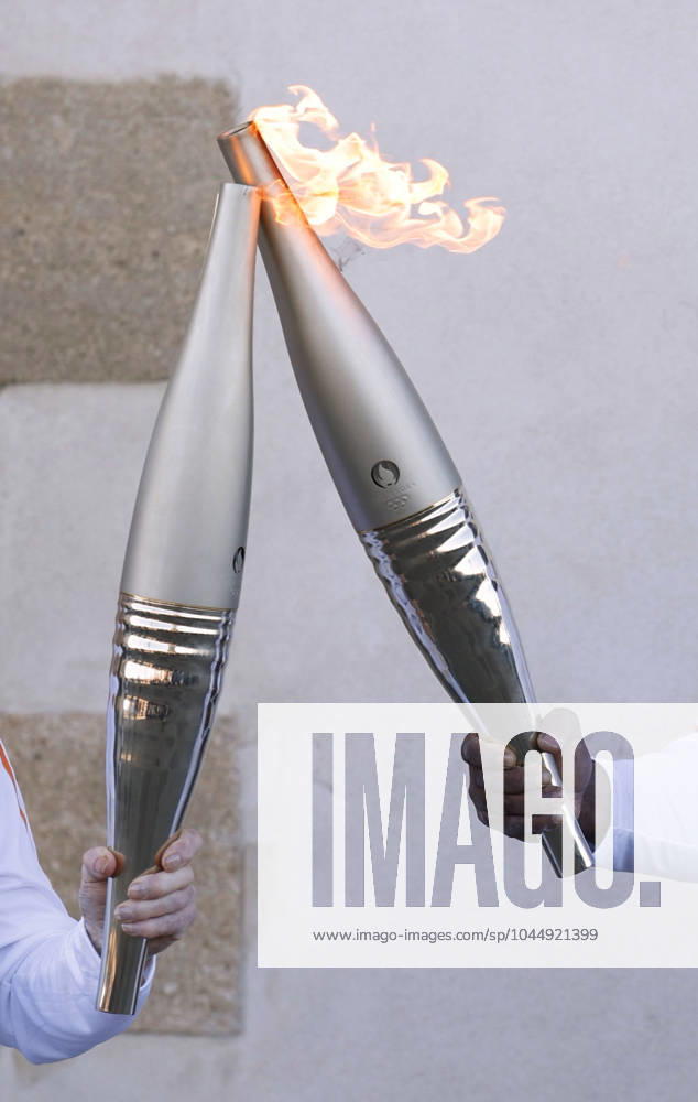 Paris Olympic torch relay begins Torchbearers perform a torch kiss in Marseille on May 9, 2024, as the Paris Olympic torch relay begins following the arrival of the Olympic flame in the southern French port city on a majestic three-mast ship. About 10,000 torchbearers are to pass through over 400 towns until the games opening ceremony in Paris on July 26. A14AA0002809163P