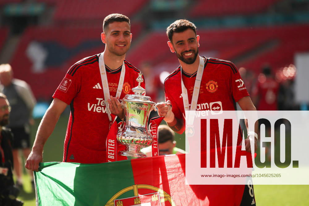 Diogo Dalot of Manchester United, ManU and Bruno Fernandes (c) of Manchester United celebrate with the supporters during The FA Cup Final match between Manchester City and Manchester United at Wembley Stadium, London, England on 25 May 2024.