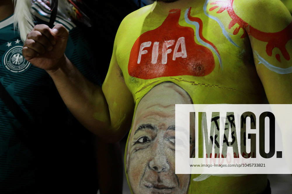 A spectator was seen painting his body with the face of FIFA President, Gianni Infantino before watching the FIFA U-17 World Cup Final match between Germany and France at Manahan Stadium. Surakarta Indonesia - ZUMAb228 20231202_zip_b228_054