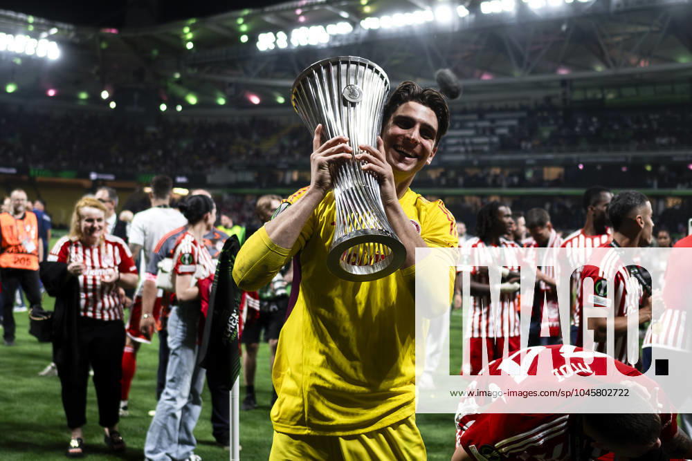 Olympiacos FC v ACF Fiorentina - UEFA Conference League Konstantinos Tzolakis of Olympiacos FC celebrates with the trophy during the award ceremony following the UEFA Conference League final football match between Olympiacos FC and ACF Fiorentina. Athens Greece