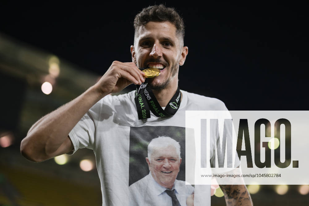 Olympiacos FC v ACF Fiorentina - UEFA Conference League Stevan Jovetic of Olympiacos FC bites his medal during the award ceremony following the UEFA Conference League final football match between Olympiacos FC and ACF Fiorentina. Athens Greece