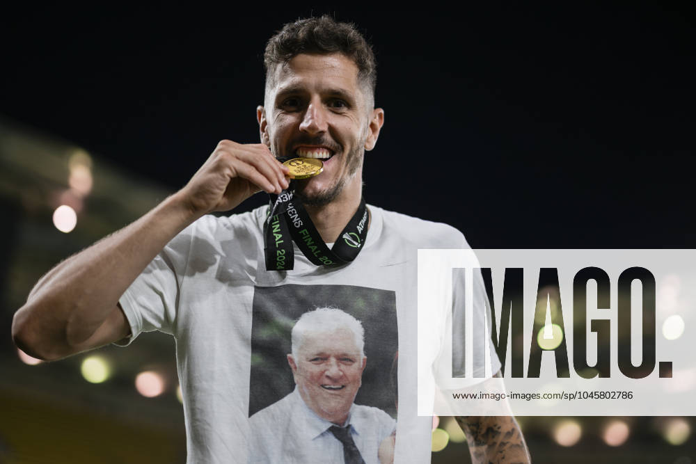 Olympiacos FC v ACF Fiorentina - UEFA Conference League Stevan Jovetic of Olympiacos FC bites his medal during the award ceremony following the UEFA Conference League final football match between Olympiacos FC and ACF Fiorentina. Athens Greece