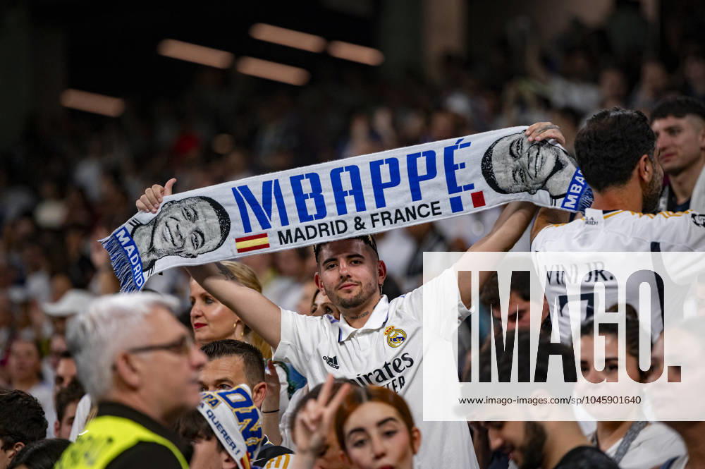 Real Madrid UEFA Champions League Trophy Parade 2024 A Real Madrid fan with a scarf showing the face of Kylian Mbappe during Real Madrid UEFA Champions League Trophy Parade on June 2, 2024 in Madrid, Spain. Madrid Estadio Santiago Bernabeu Madrid Spain
