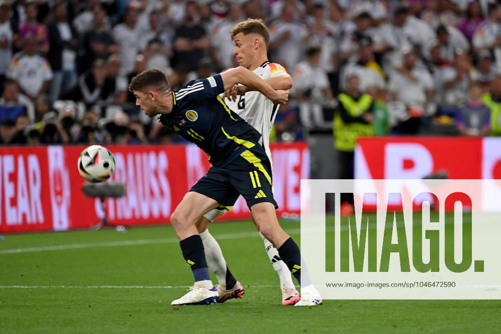 Football EM 2024, Germany Scotland, v l Ryan Christie Team Scotland Joshua Kimmich German National Football Team DFB Zweikampf, action, action, battle for the ball Munich