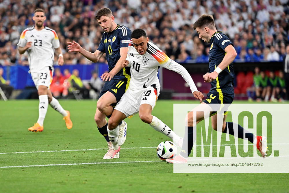 Football EM 2024, Germany Scotland, v l Ryan Christie Team Scotland Jamal Musiala Deutsche Fussball Nationalmannschaft DFB Kieran Tierney Team Scotland Zweikampf, Aktion, action, battle for the ball Munich