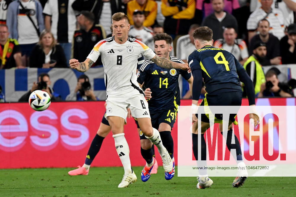European Football Championship 2024, Germany Scotland, v l Toni Kroos German National Football Team DFB Billy Gilmour Team Scotland Scott Mctominay Team Scotland duel, action, action, battle for the ball Munich