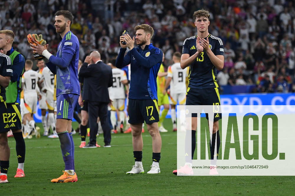 Football EM 2024, Germany Scotland, v l Angus Gunn Team Scotland Stuart Armstrong Team Scotland Jack Hendry Team Scotland sad, disappointed, frustrated, dejected DFLB DFB REGULATIONS PROHIBIT ANY USE OF PHOTOGRAPHS as IMAGE SEQUENCES and or QUASI VIDEO Munich