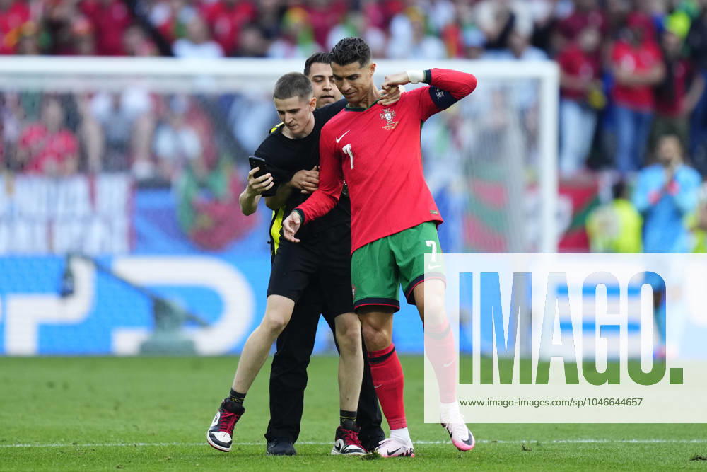 Turkiye v Portugal: Group F - UEFA EURO, EM, Europameisterschaft,Fussball 2024 Pitch invader with Cristiano Ronaldo centre-forward of Portugal and Al-Nassr FC during the UEFA EURO 2024 group stage match between Turkiye and Portugal at Football Stadium Dortmund on June 22, 2024 in Dortmund, Germany. Dortmund Germany