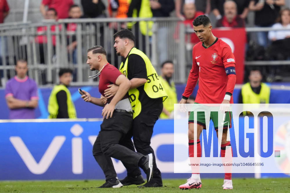 Several pitch invasion to take pics with Portugal s Cristiano Ronaldo during the Euro 2024 soccer match between Turkey and Portugal at the Signal Iduna Park, Dortmund, Germany - Saturday June 22 , 2024. - Soccer .