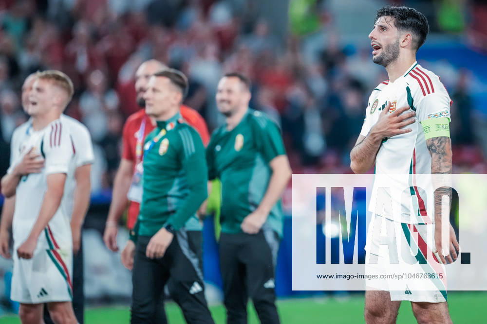 EURO 2024 - Matchday 3, Group A: Scotland vs. Hungary Dominik Szoboszlai touches his crest, as fans sing Hungary s national anthem, after the EURO 2024 Matchday 3, Group A match between Scotland and Hungary on 23 June 2024, at Stuttgart Arena, in Stuttgart, Germany Stuttgart Stuttgart Arena Germany