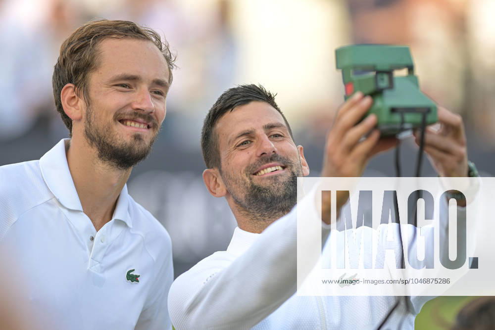 KW26 Novac Djokovic wins the second ATP, Tennis Herren Exhibition single mnatch against Daniil Medvedev and shares his want for a Polaroid selfie at the end of the game during the Giorgio Armani Tennis Classic at the Hurlingham Club, London, UK on 28 June 2024.