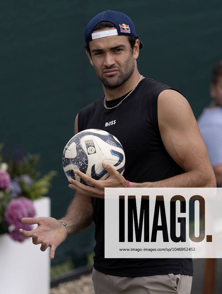Matteo Berrettini of Italy holds a football Wimbledon Tennis Championships, Practice and Previews, The All England Lawn Tennis and Croquet Club, London, UK - 30 Jun 2024 No use with unauthorised audio, video, data, fixture lists (outside the EU), club league logos or live services. Online in-match use limited to 45 images (+15 in extra time). No use to emulate moving images. No use in betting, games or