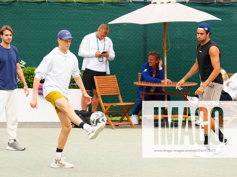 Jannik Sinner plays football with Matteo Berrettini Wimbledon Tennis Championships, Practice and Previews, The All England Lawn Tennis and Croquet Club, London, UK - 30 Jun 2024 No use with unauthorised audio, video, data, fixture lists (outside the EU), club league logos or live services. Online in-match use limited to 45 images (+15 in extra time). No use to emulate moving images. No use in betting, games or