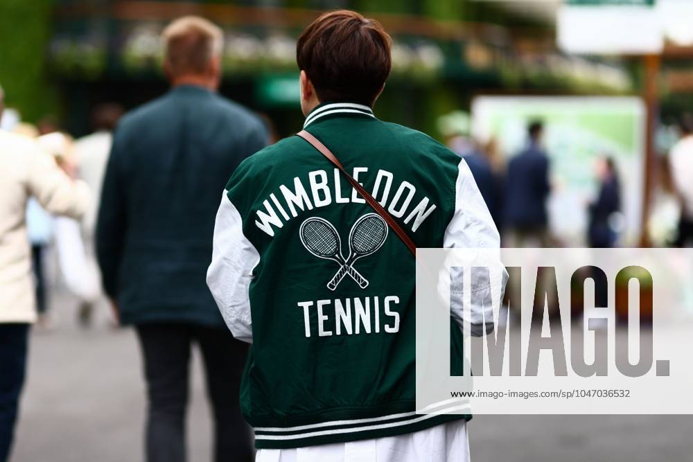 Spectator arrives on day two wearing a Wimbledon Tennis bomber jacket Wimbledon Tennis Championships, Day 2, The All England Lawn Tennis and Croquet Club, London, UK - 02 Jul 2024