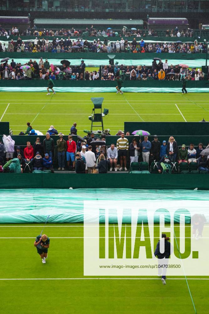 The covers are brought on as rain starts to fall Wimbledon Tennis Championships, Day 2, The All England Lawn Tennis and Croquet Club, London, UK - 02 Jul 2024