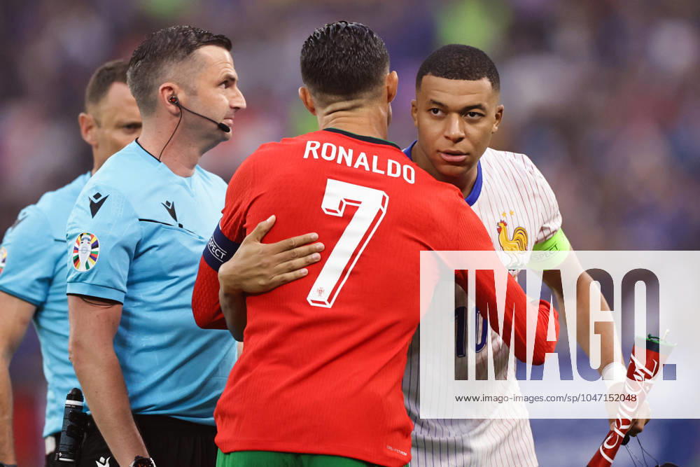 Portugal v France: Quarter-Final - UEFA EURO, EM, Europameisterschaft,Fussball 2024 Cristiano Ronaldo of Portugal is greeting Kylian Mbappe of France ahead of the UEFA Euro 2024 quarter-final football match between France and Portugal at Volksparkstadion Stadium in Hamburg, Germany. Hamburg Germany