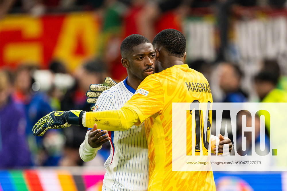 Portugal v France, UEFA EURO, EM, Europameisterschaft,Fussball 2024, Hamburg, Germany Hamburg, Germany. 05th, July 2024. Goalkeeper Mike Maignan (16) of France seen with Ousmane Dembele during the UEFA Euro 2024 quarter final match between Portugal and France at Volksparkstadion in Hamburg. Hamburg Germany