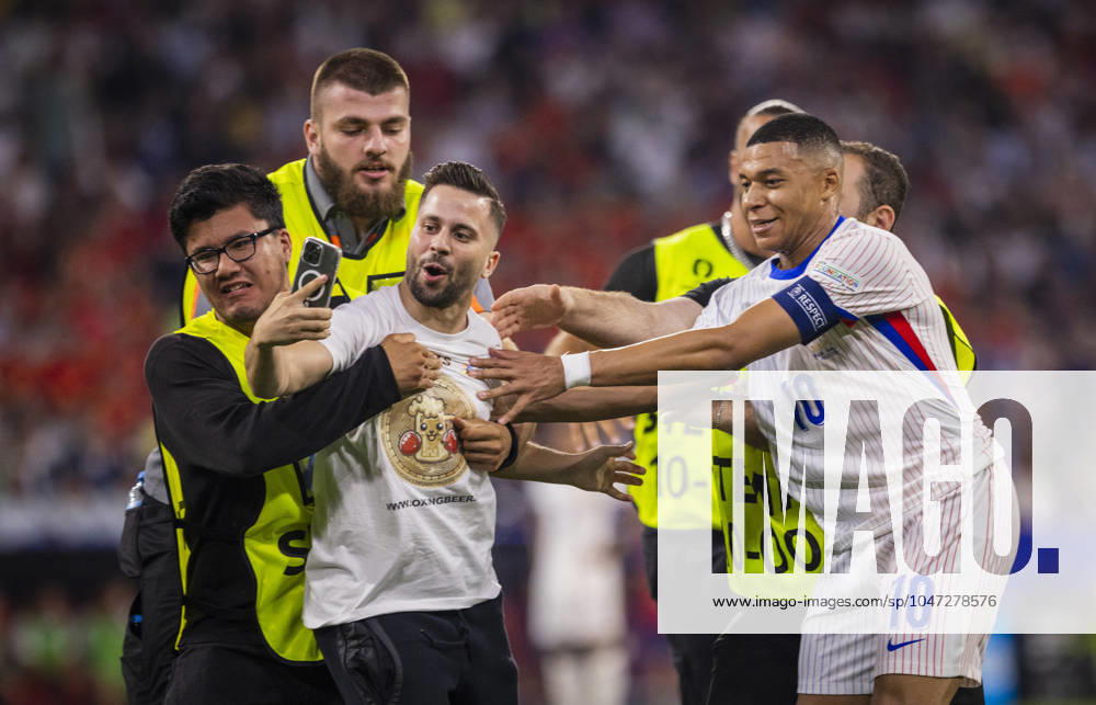 Munich, Germany 09th Jul 2024 Speedster takes a selfie with Kylian Mbappe FRA and is stopped by stewards Spain France Spain France 09 07 2024