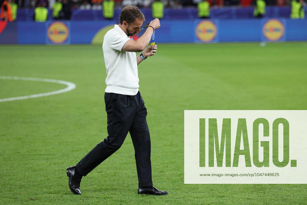 Berlin, Germany, 14th July 2024. Gareth Southgate manager of England takes off his silver medal during the UEFA European Championships final match at Olympiastadion, Berlin. Picture: Paul Terry Sportimage . SPI-3227-0212