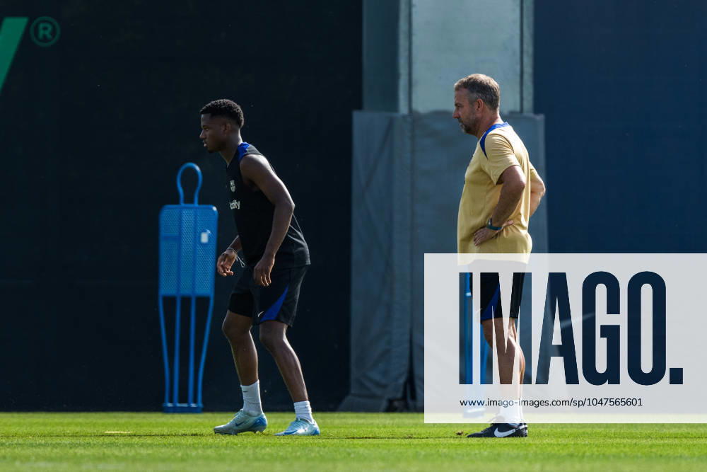 (240720) -- BARCELONA, July 20, 2024 -- FC Barcelona, Barca s head coach Hansi Flick and player Ansu Fati (L) attend a training session at the Joan Gamper training ground, near Barcelona, Spain, on July 19, 2024. (Photo by Xinhua) (SP)SPAIN-BARCELONA-FOOTBALL-TRAINING SESSION Joanxgosa
