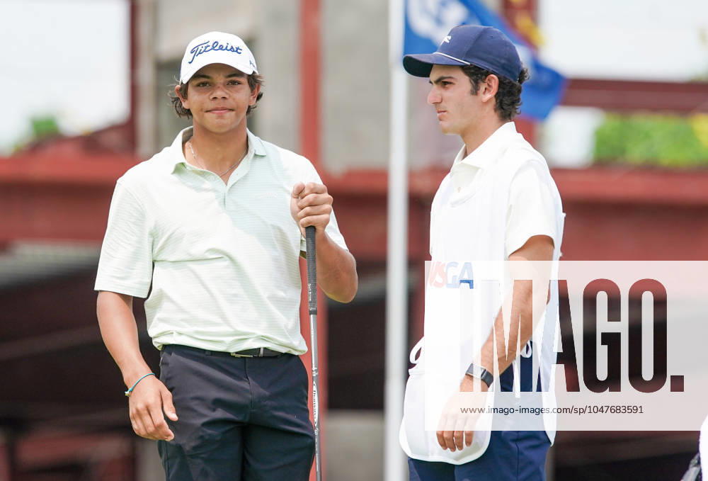 Charlie Woods (USA)(L) and his caddie Luke Wise wait on the 1st hole - North Course during the second round of the 2024 U.S. Junior Amateur Championship at Oakland Hills Country Club. Bloomfield Hills USA - ZUMAw109 20240723_fap_w109_001