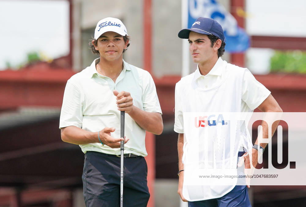 Charlie Woods (USA)(L) and his caddie Luke Wise wait on the 1st hole - North Course during the second round of the 2024 U.S. Junior Amateur Championship at Oakland Hills Country Club. Bloomfield Hills USA - ZUMAw109 20240723_fap_w109_017