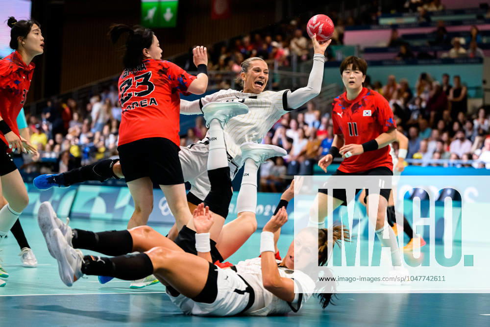 Paris, France Handball Women Preliminary Round Group A Germany Korea from left Bitna Woo Korea , Julia Behnke Germany , Xenia Smits Germany on the floor Paris South Paris Arena 6 France