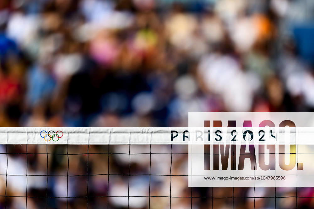 FRA, Summer Olympics Paris 2024, Beach Volleyball , Preliminary Round Group C, Match 3, Ehlers Wickler GER vs Bassereau Lyneel FRA 30 07 2024, Champ de Mars, Paris, FRA, Summer Olympics Paris 2024, Beach Volleyball , Preliminary Round Group C, Match 3, Ehlers Wickler GER vs Bassereau Lyneel FRA , in the picture feature Volleyball net with the Olympic rings and the lettering Paris 2024 nordphotoxGmbHx xStraubmeier nph00004