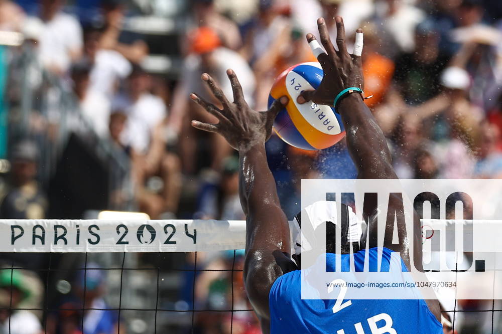FRANCE, PARIS - JULY 30, 2024: Jorge Luis Alayo Moliner of Cuba competes in a men s Pool D - Preliminary Phase Beach volleyball, Beachvolleyball match between Brazil and Cuba at the 2024 Summer Olympic Games, Olympische Spiele, Olympia, OS by the Eiffel Tower on the Champ de Mars. 72537205