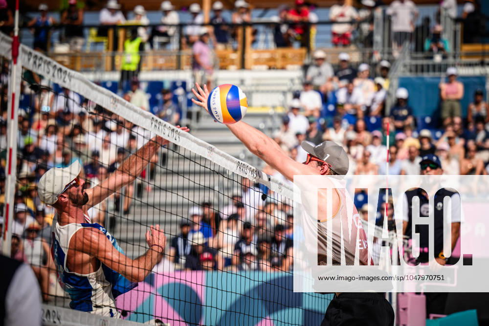 Paris, Eiffel Tower Stadium Beach volleyball, Olympic Games, preliminary round Attack Julien Lyneel FRA, left block Nils Ehlers GER