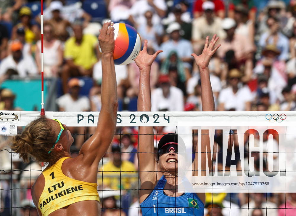 RUSSIA, PARIS - JULY 30, 2024: Brazil s Carolina Solberg Salgado (R) and Lithuania s Monika Paulikene play a womenâ€s Pool E Beach volleyball, Beachvolleyball match during the 2024 Summer Olympics at the Eiffel Tower Stadium on the Champ de Mars. Alexander Shcherbak TASS 72546292