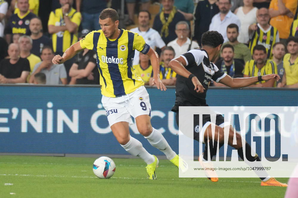 Edin Dzeko (L) of Fenerbahce and Ayman El Wafi (22) of Lugano during the UEFA Champions League second qualifying round second leg match between Fenerbahce and Lugano at Ulker Stadium on July 30, 2024 in Istanbul, Turkey. Istanbul Kadikoy Turkey