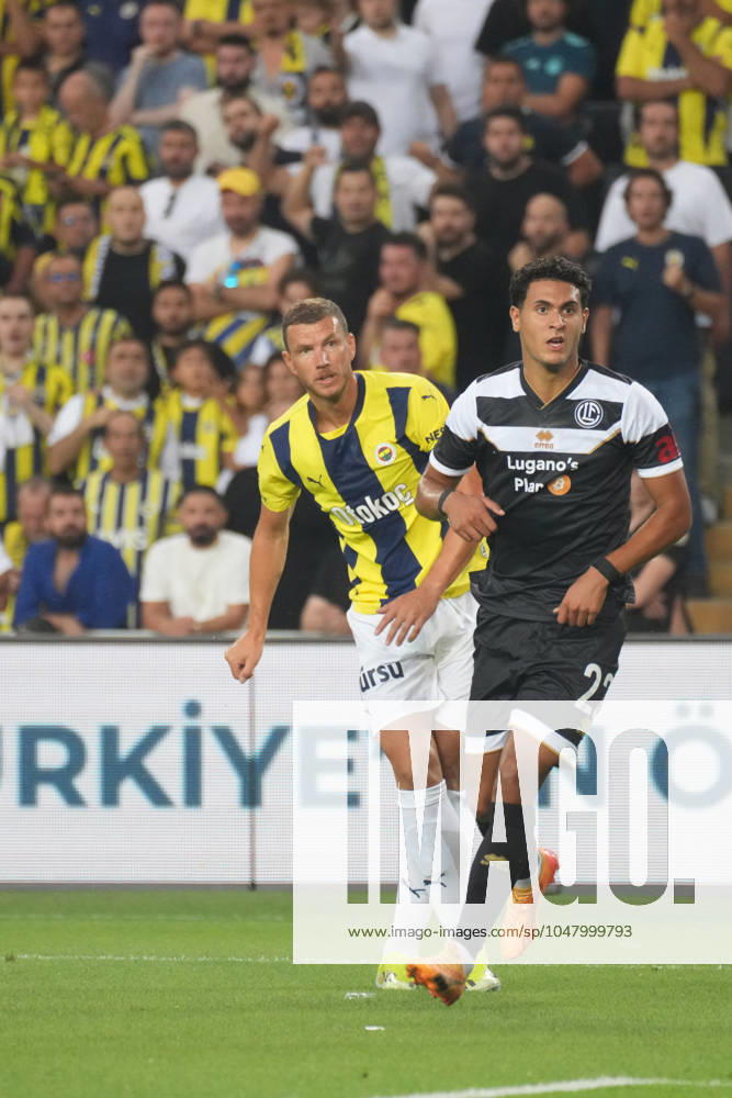 Edin Dzeko (L) of Fenerbahce and Ayman El Wafi (22) of Lugano during the UEFA Champions League second qualifying round second leg match between Fenerbahce and Lugano at Ulker Stadium on July 30, 2024 in Istanbul, Turkey. Istanbul Kadikoy Turkey