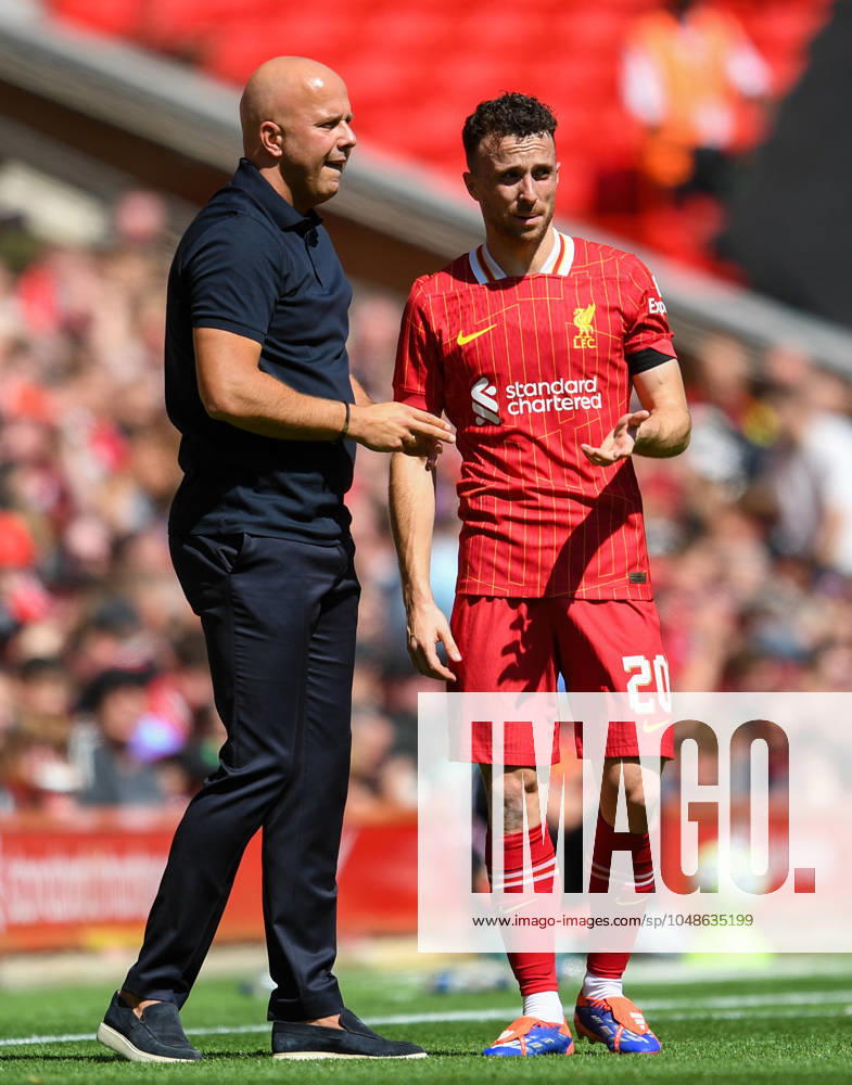Liverpool v Sevilla Pre-Season Friendly Liverpool Head Coach Arne Slot talks to Diogo Jota during the Pre-Season Friendly match at Anfield, Liverpool UK Newspapers OUT