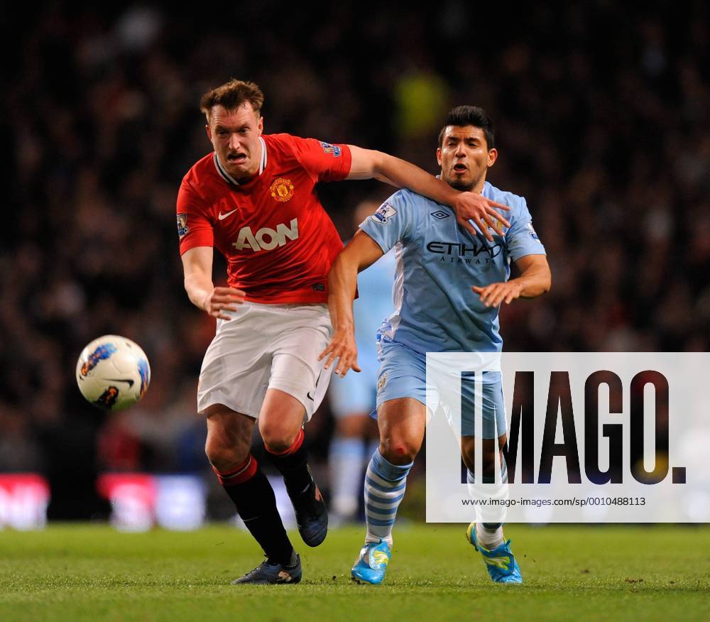 Phil Jones of Manchester United tussles with Sergio Kun Agüero of Manchester City.Barclays Premier League match between Manchester City v Manchester Utd at the Etihad Stadium, Manchester on the 30th April 2012.. .