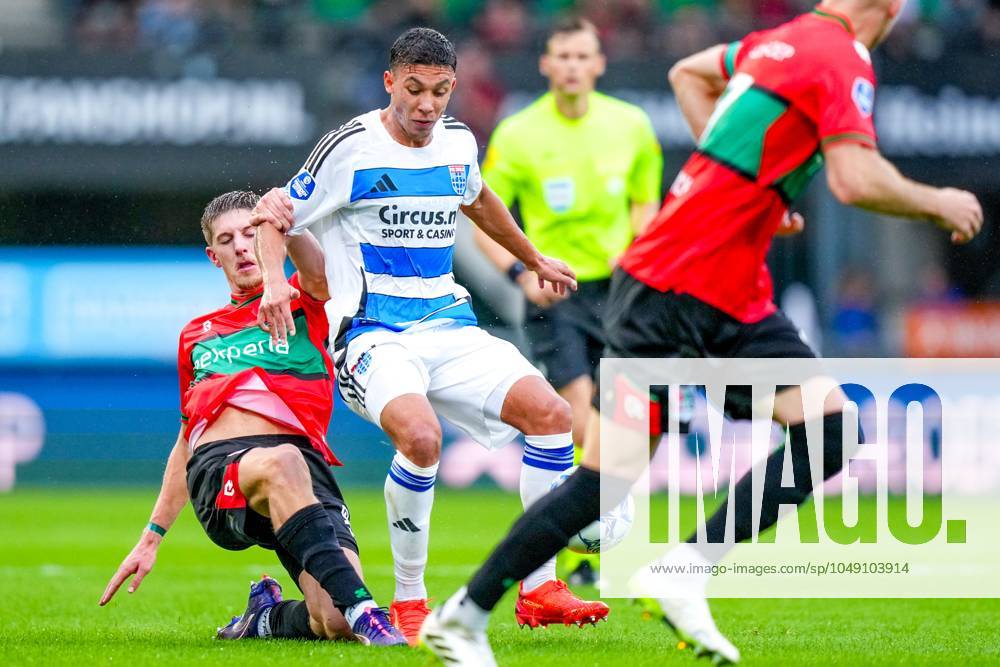 NIJMEGEN, 24-08-2024, Stadion De Goffert, football, Dutch Eredivisie , season 2024 2025, During the match NEC - PEC Zwolle. NEC player Mees Hoedemakers and PEC Zwolle player Filip Krastev NEC - PEC Zwolle x26113427x