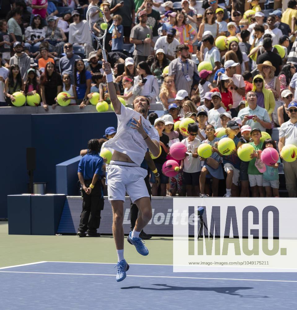 Fans hold giant tennis balls hoping for autographs as DANIILL MEDVEDEV practices ahead of start of US Open Championship at USTA B. Jean King National Tennis Center in New York on August 24, 2024 New York United States - ZUMAr339 20240824_znp_r339_073