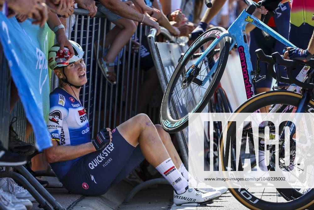 Belgian Tim Merlier of Soudal Quick-Step sits on the ground after crashing during the sprint of the first stage of the Renewi Tour multi-stage cycling race, from Riemst to Bilzen (163,6 km) on Wednesday 28 August 2024. The five-day race takes place in Belgium and the Netherlands. DAVIDxPINTENS x99251448x