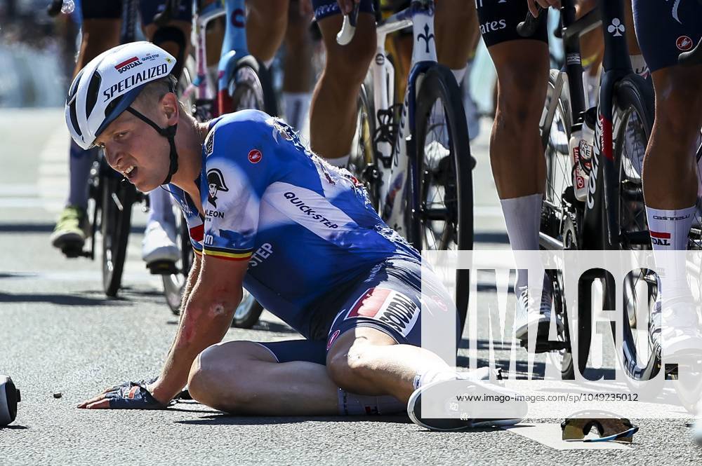 Belgian Tim Merlier of Soudal Quick-Step sits on the ground after crashing during the sprint of the first stage of the Renewi Tour multi-stage cycling race, from Riemst to Bilzen (163,6 km) on Wednesday 28 August 2024. The five-day race takes place in Belgium and the Netherlands. DAVIDxPINTENS x99251558x