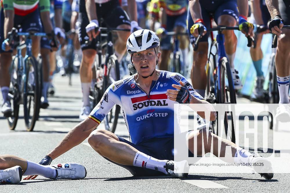 Belgian Tim Merlier of Soudal Quick-Step sits on the ground after crashing during the sprint of the first stage of the Renewi Tour multi-stage cycling race, from Riemst to Bilzen (163,6 km) on Wednesday 28 August 2024. The five-day race takes place in Belgium and the Netherlands. DAVIDxPINTENS x99251864x