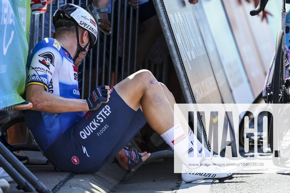 Belgian Tim Merlier of Soudal Quick-Step sits on the ground after crashing during the sprint of the first stage of the Renewi Tour multi-stage cycling race, from Riemst to Bilzen (163,6 km) on Wednesday 28 August 2024. The five-day race takes place in Belgium and the Netherlands. DAVIDxPINTENS x99251865x